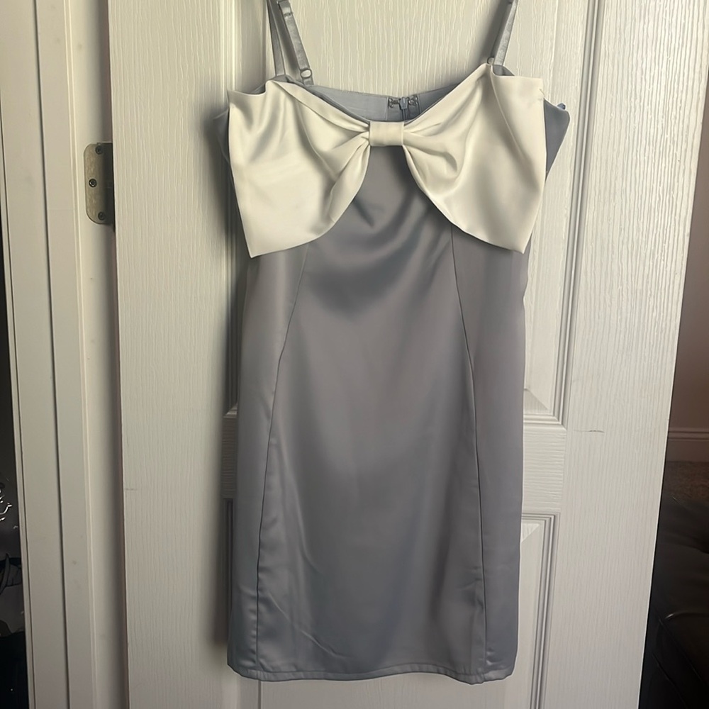 Shop these three, silky light blue mini dress w/ white bow accent, size medium